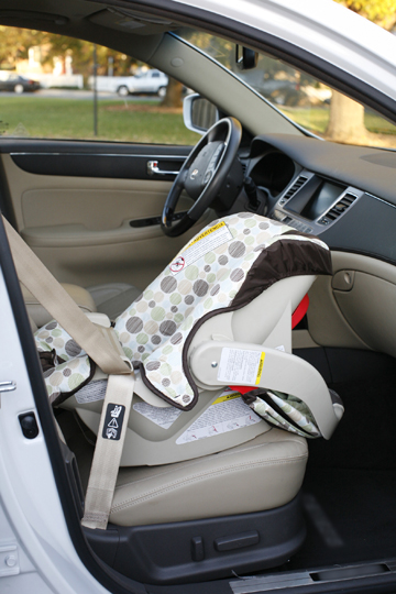 Infant car seat in front seat. Improper use