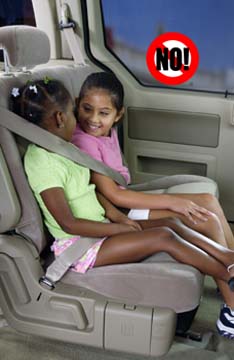 Girls with improper seat belt